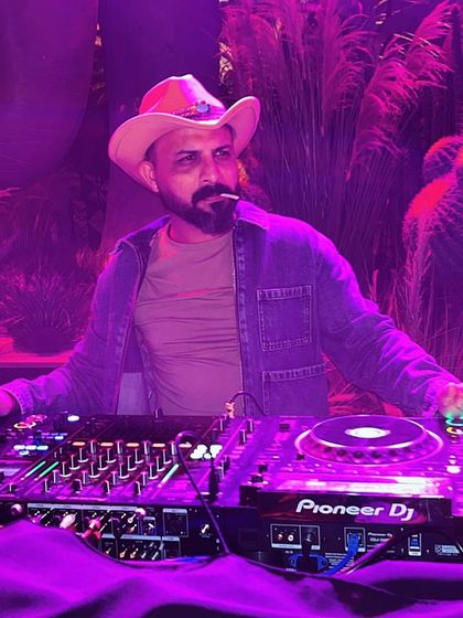 A stylized shot of me at a themed party, rocking a cowboy hat and enjoying the vibe. It's all about the attitude.