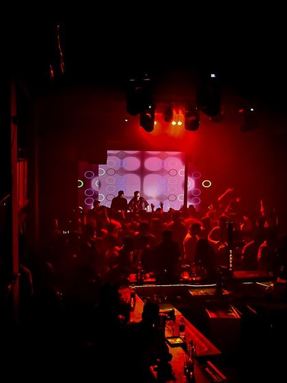 The deep red lighting sets a powerful mood. This is the kind of immersive environment I create, where the whole room is part of the experience.