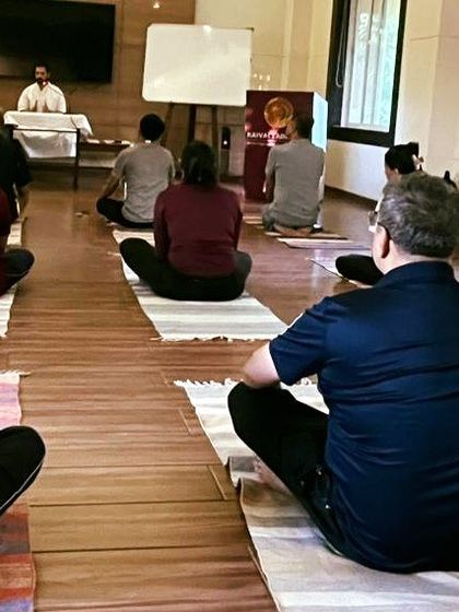 Participants listen attentively during the theoretical portion of our Suddhi Kriya workshop. We ensure everyone has a solid conceptual understanding before engaging in the practical techniques.