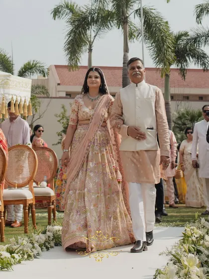 Some moments are priceless. We create the perfect setting for these deeply emotional memories, like a father walking his daughter down an aisle lined with flowers, ensuring the focus remains on the love that fills the air.