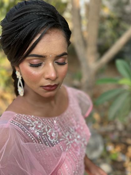 The elegant details of the makeup and hairstyle.