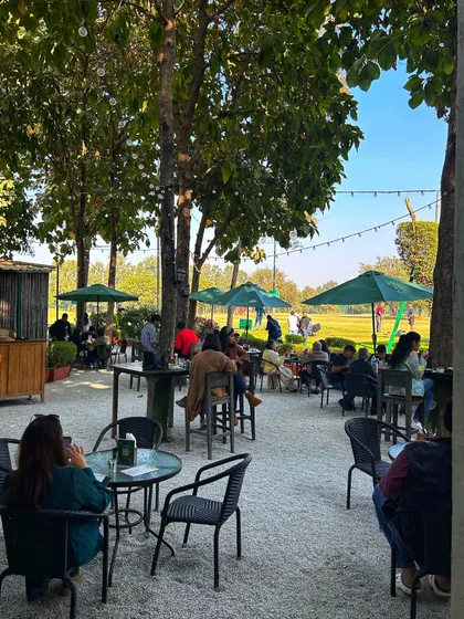 A view of the cafe patio from the course, showing how integrated our facilities are.