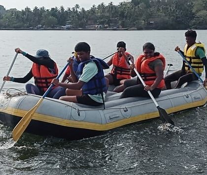 A team learns to paddle a raft together, an essential skill for our multi-activity water sports camps.