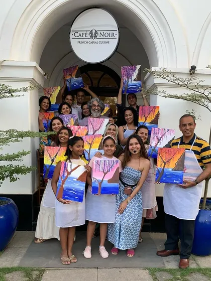 We took the paint party on the road to Kochi. A whole group of us painted right by Cafe Noir, soaking in the city's charm. It’s so cool to see everyone’s artwork come together, each one a little different but all so beautiful.