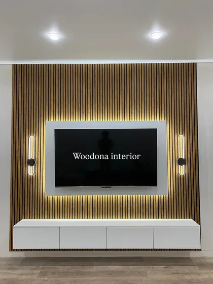 This is one of my most requested TV unit styles. The combination of vertical wooden fluted panels, a clean white floating console, and warm backlighting creates a modern and elegant focal point for any living room.