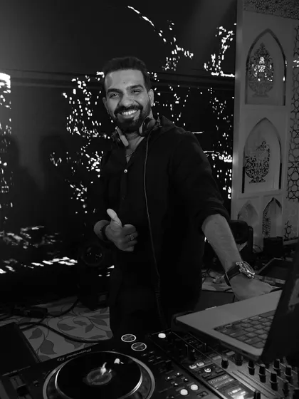 In my zone, chasing that perfect drop. These black and white shots capture the focus and joy I find in creating the perfect party atmosphere.