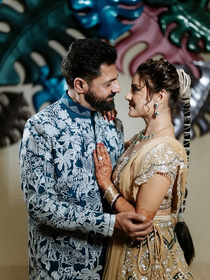 An intimate moment amidst the Sangeet madness. We design spaces that allow for both grand celebrations and quiet, personal connections.