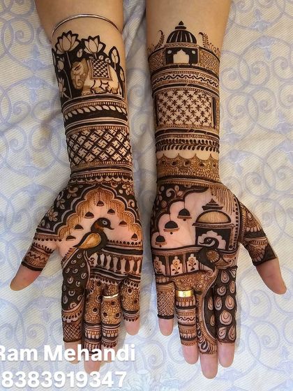 A complete view of a matching set of bridal hands. The design includes peacocks, elephants, and architectural domes for a truly royal look.