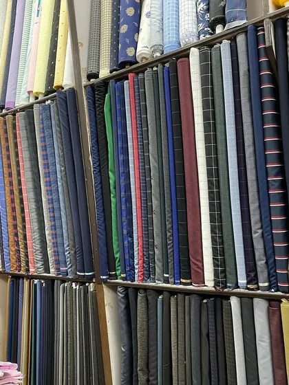 Another view of the fabric collection at H.K Tailors. The right color and pattern can define your look, and I have hundreds of options for you to choose from.