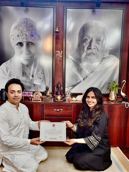 It fills my heart with joy to see my students complete their journey. Here, I am with a student and my own teacher, celebrating the completion of a 500-hour certification.