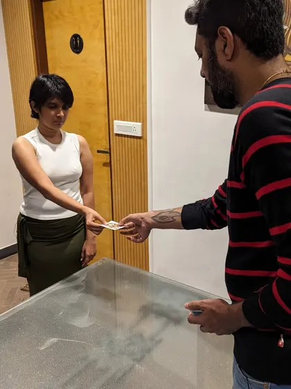 A photo of me interacting with an audience member during my first ticketed event. It was a huge milestone.