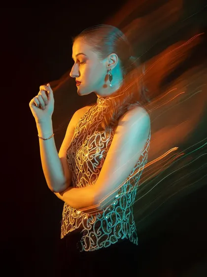 A similar profile shot, but with a different hand position and light trail. We can create so many variations with this technique.