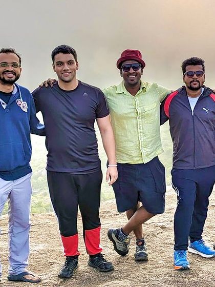 A group of friends posing on a trail. These are the memories from our last weekend treks, filled with laughter and beautiful scenery.