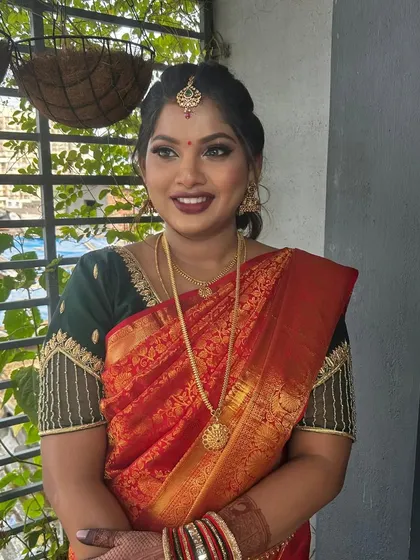A happy portrait of the mom-to-be. Her makeup is fresh and glowing, designed to make her feel special on her baby shower day.