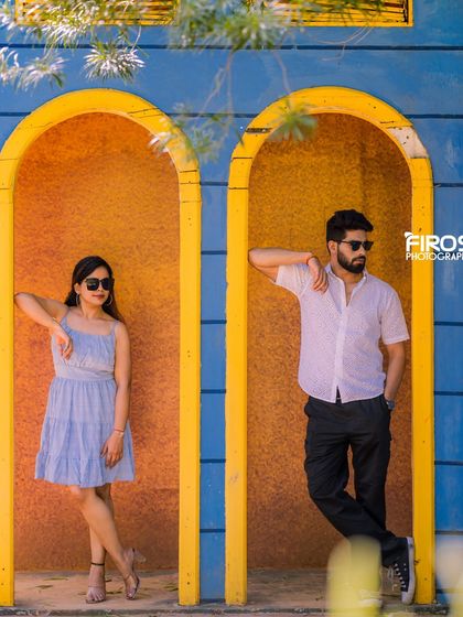 A cool and casual pose in the quirky blue and yellow arched doorways, perfect for a modern and fun pre-wedding shoot.