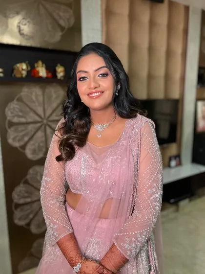 A beautiful, happy client ready for her engagement party. The soft glam makeup enhances her features without feeling heavy.