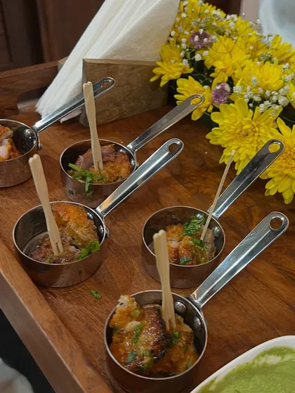 Bite-sized Indian appetizers served in charming mini pans. This presentation style is part of our boutique catering service, adding a unique and memorable touch to your event's food display.