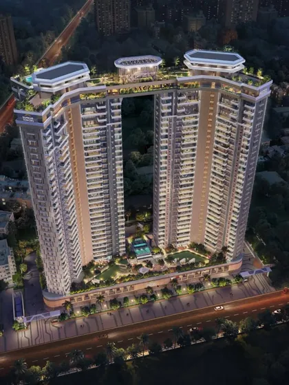 This aerial view captures the dramatic presence of our twin residential towers in Pune, connected by a signature sky bridge. The design creates a new landmark on the city skyline while offering residents unparalleled views and exclusive rooftop amenities.