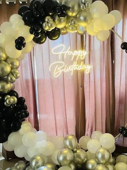 A modern and elegant birthday balloon ring in a monochrome palette of black, white, and chrome silver.