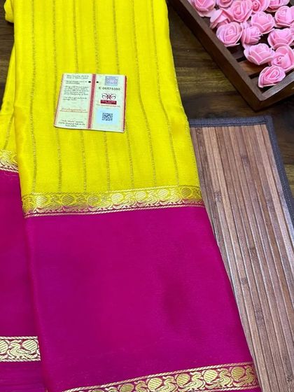 A bright yellow and pink wrinkle crepe Mysore silk saree.