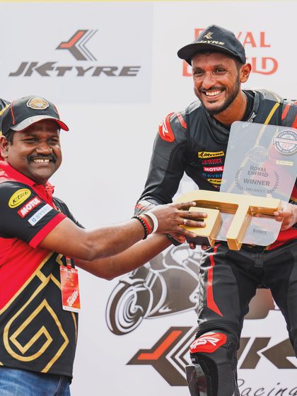Anish Shetty receiving his trophy on the podium, a proud moment for the entire PRN Motorsport team.