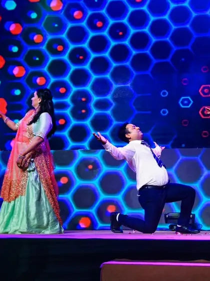 The secret ingredient to a fun family performance is a combination of playful teasing and a sprinkle of love. This photo captures that perfectly.