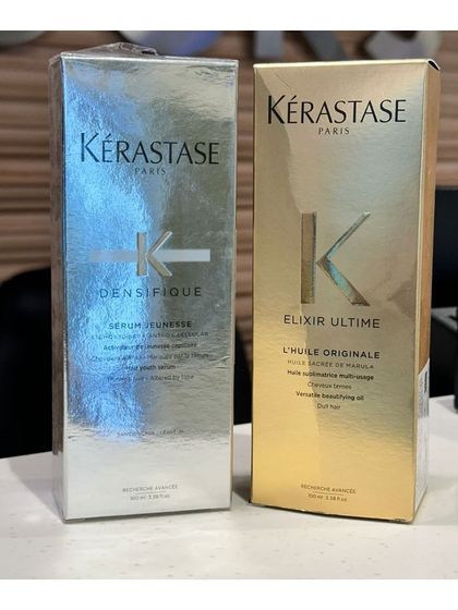 The boxed packaging of Kérastase Densifique and Elixir Ultime serums, perfect for gifting or treating yourself to luxury hair care.