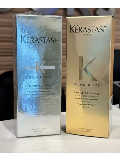 The boxed packaging of Kérastase Densifique and Elixir Ultime serums, perfect for gifting or treating yourself to luxury hair care.