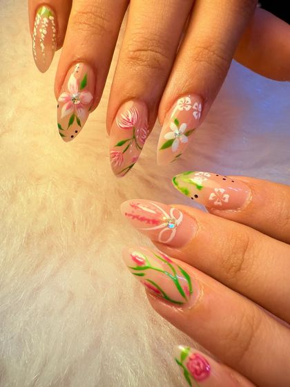 This delicate, hand-painted floral set is perfect for a soft, romantic look. We used a neutral base to let the intricate pink and white flowers with green stems truly stand out, creating a bouquet on your fingertips.