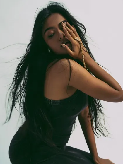 Even in a minimal shoot, hair movement adds a dynamic element. A gentle breeze from a fan creates a soft, flowing effect that contrasts with the model's still pose, adding a touch of life and energy.