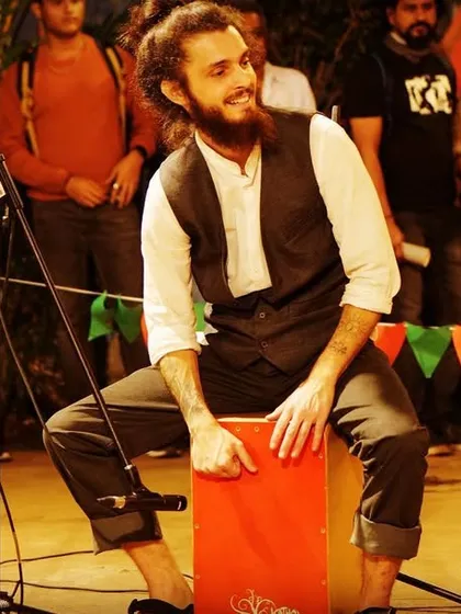 My talented percussionist playing the cajon at an outdoor festival.