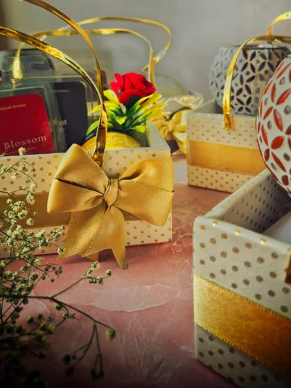 A close-up of the elegant details in my custom gift baskets. The combination of the wax warmer, scented products, and delicate artificial flowers makes for a beautiful and functional gift.