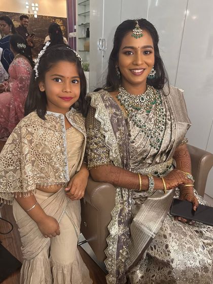 A sweet photo of Sruthi with her bridesmaid. It's always special to capture these moments with loved ones during the wedding festivities.