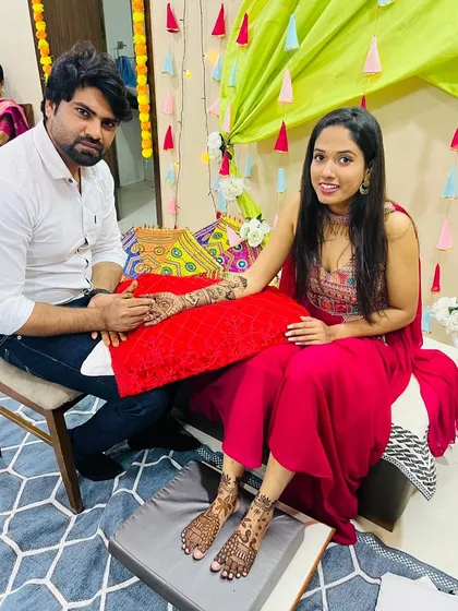 Me with a happy bride after completing her hand and foot mehandi. Seeing our clients smile is the best part of our job.