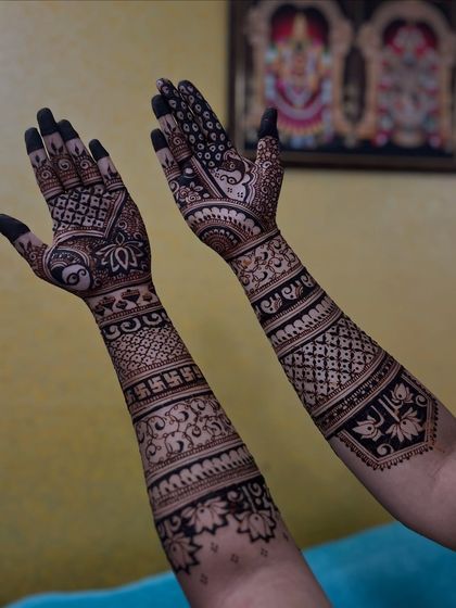 A beautiful design for the back of the hands, featuring a swastika for good luck and other traditional symbols.