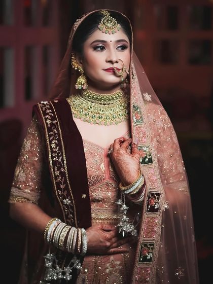 You are so beautiful. A lovely portrait of my bride Riya in her unique peach and maroon lehenga.
