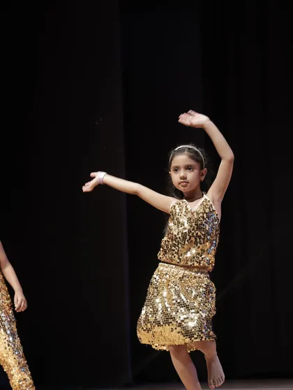 Grace and poise from a young performer. We focus on teaching fundamental dance postures and expressions that build a strong foundation for future learning.