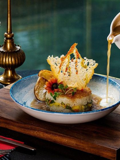 This pan-seared fish with a delicate tuile is another star of our summer menu, combining artistry with fresh, seasonal flavors.