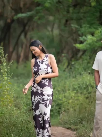 A quiet, candid moment captured during a pre-wedding walk in the woods. The natural setting and soft light create a serene and intimate atmosphere for this couple portrait.