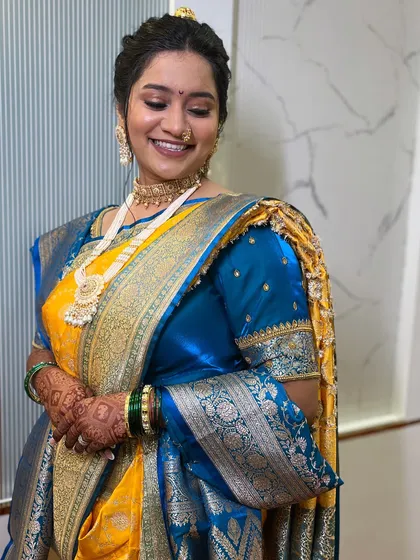 A joyful, candid shot of the bride. The makeup is designed to look great from all angles and in all lighting.