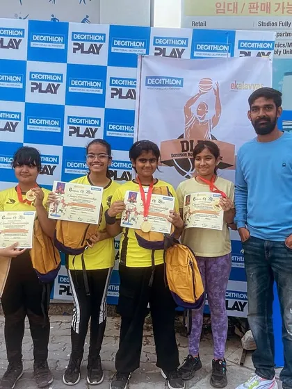 The victorious Under-12 girls team posing with their certificates and medals at the Decathlon 3x3 tournament.