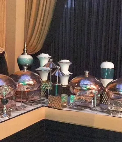 A full view of the buffet corner, showing how we use decorative elements like vases to add height and visual interest to the food display.
