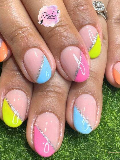 Summer's got me mixing all the shades. This fun design features different pastel-colored tips with a silver glitter line.