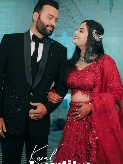 A close up reception portrait of the couple, capturing their happy smiles and the elegant details of their evening attire.