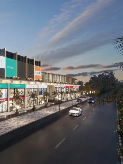An evening view of the mall, showing how the architectural lighting enhances the building's form and creates a lively atmosphere.