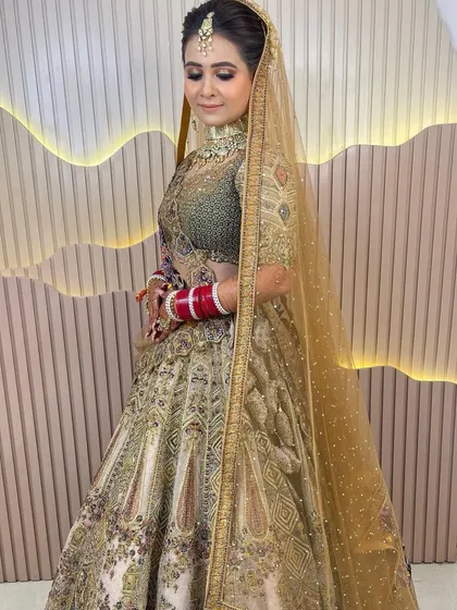 A full view of the bride in her gorgeous pastel lehenga, looking serene and beautiful.