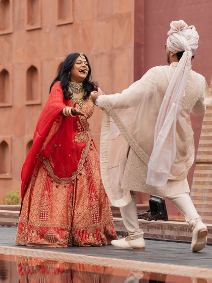 The joy of two high school sweethearts finally tying the knot, their laughter echoing against the grandeur of Jaisalmer.