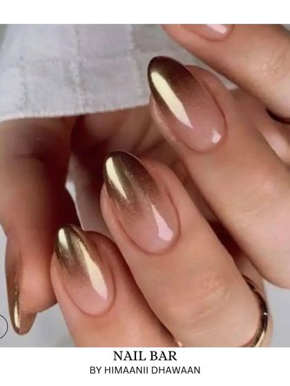 A gorgeous gold ombré chrome effect. The color fades from a natural nude base to a brilliant metallic gold tip.