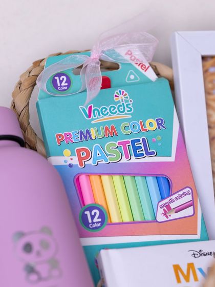 A box of premium color pastels, included to encourage artistic fun for the birthday girl.