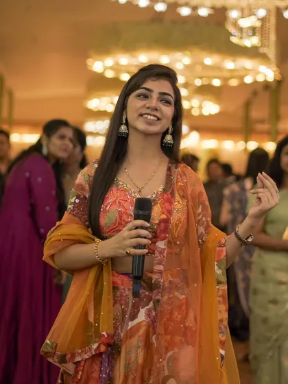 Interacting with the audience during a live event. Their smiles and participation give me immense energy.
